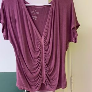 Low cut short sleeve shirt.